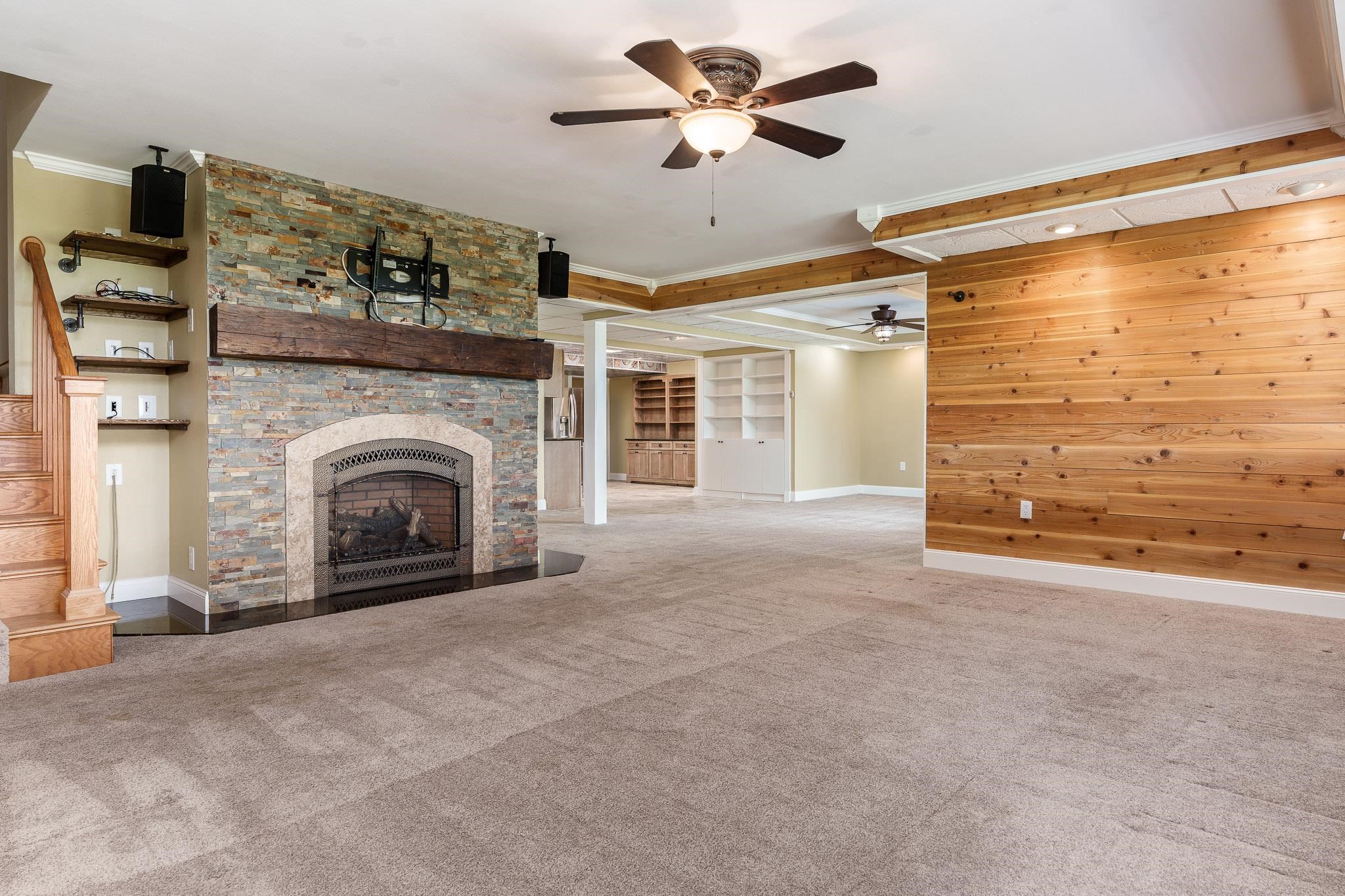 14949 Saunders Road Pecatonica, IL 61063 - Photo 51 of 88 a view of empty room with fireplace and fan