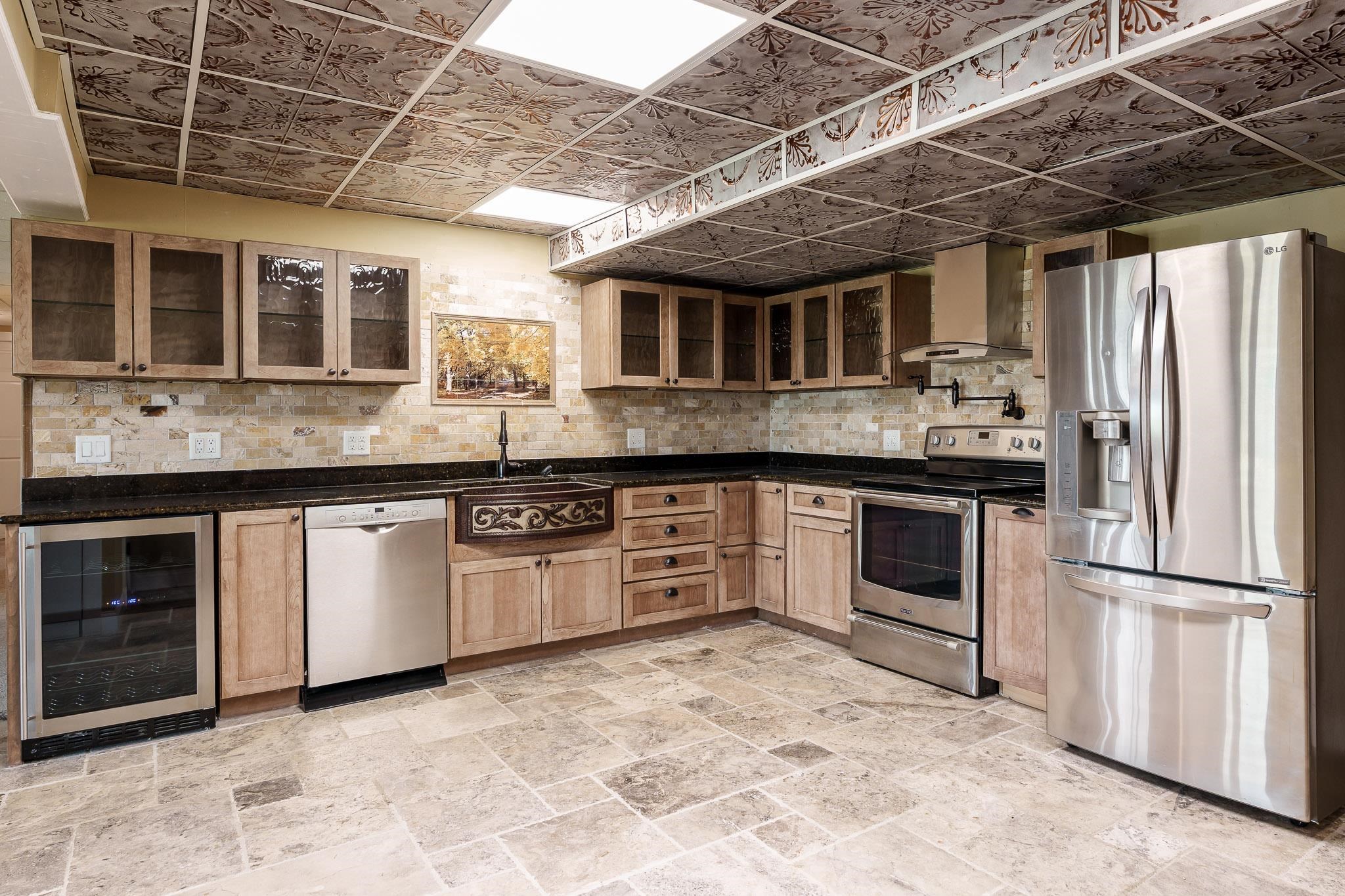 14949 Saunders Road Pecatonica, IL 61063 - Photo 52 of 88 a kitchen with stainless steel appliances granite countertop a stove a sink dishwasher and a refrigerator