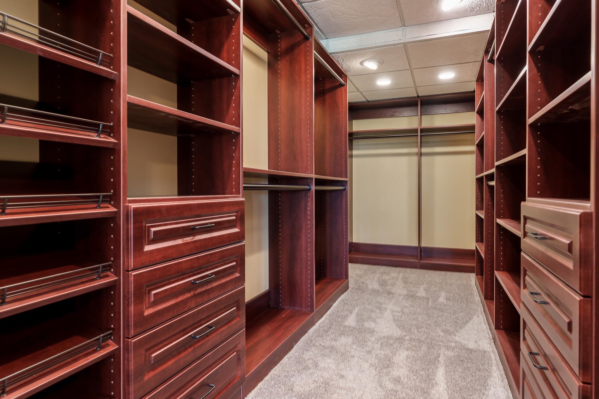 14949 Saunders Road Pecatonica, IL 61063 - Photo 66 of 88 a view of walk in closet with clothes and shoes