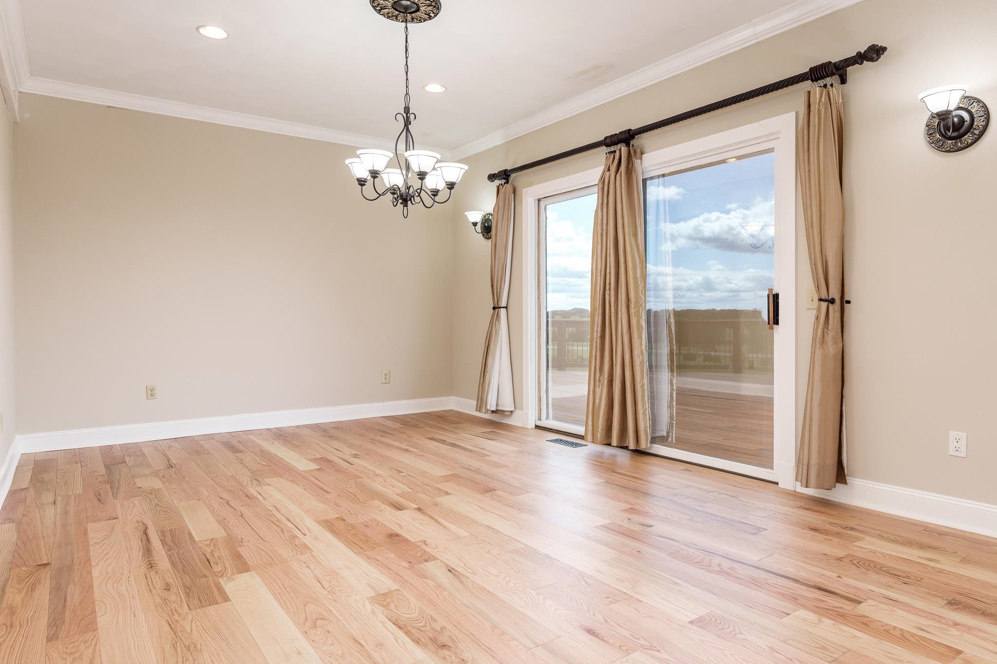 14949 Saunders Road Pecatonica, IL 61063 - Photo 7 of 88 a view of empty room with wooden floor and fan