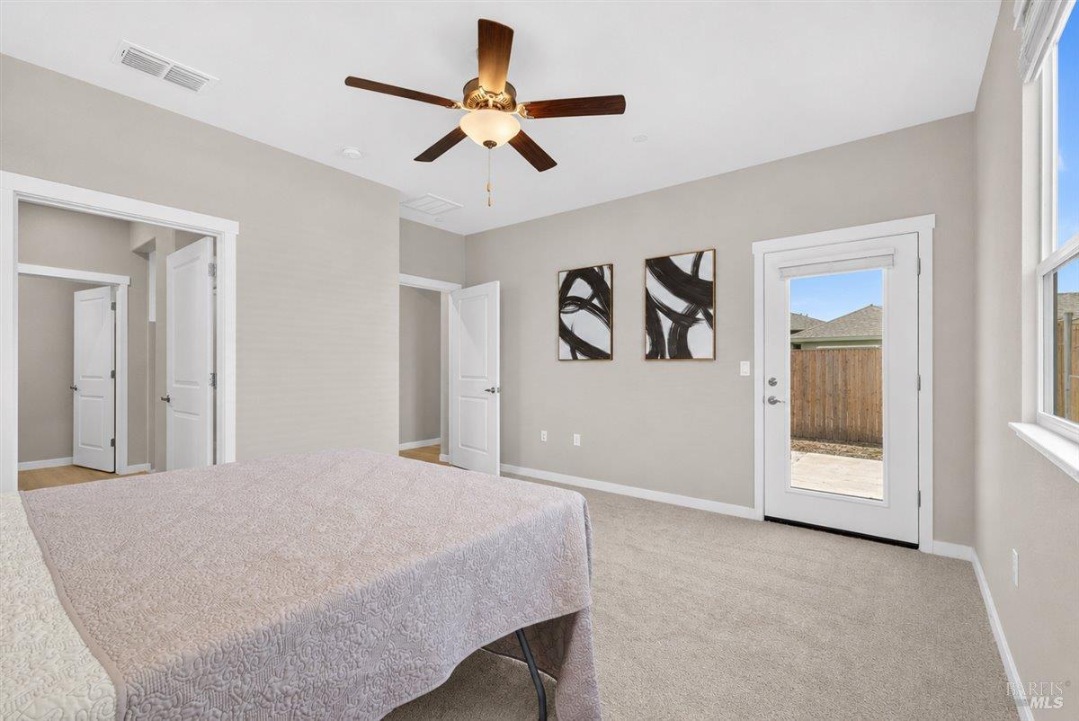2275 Revival Lane Rio Vista, CA 94571 - Photo 13 of 31 a bedroom with a large bed and a ceiling fan
