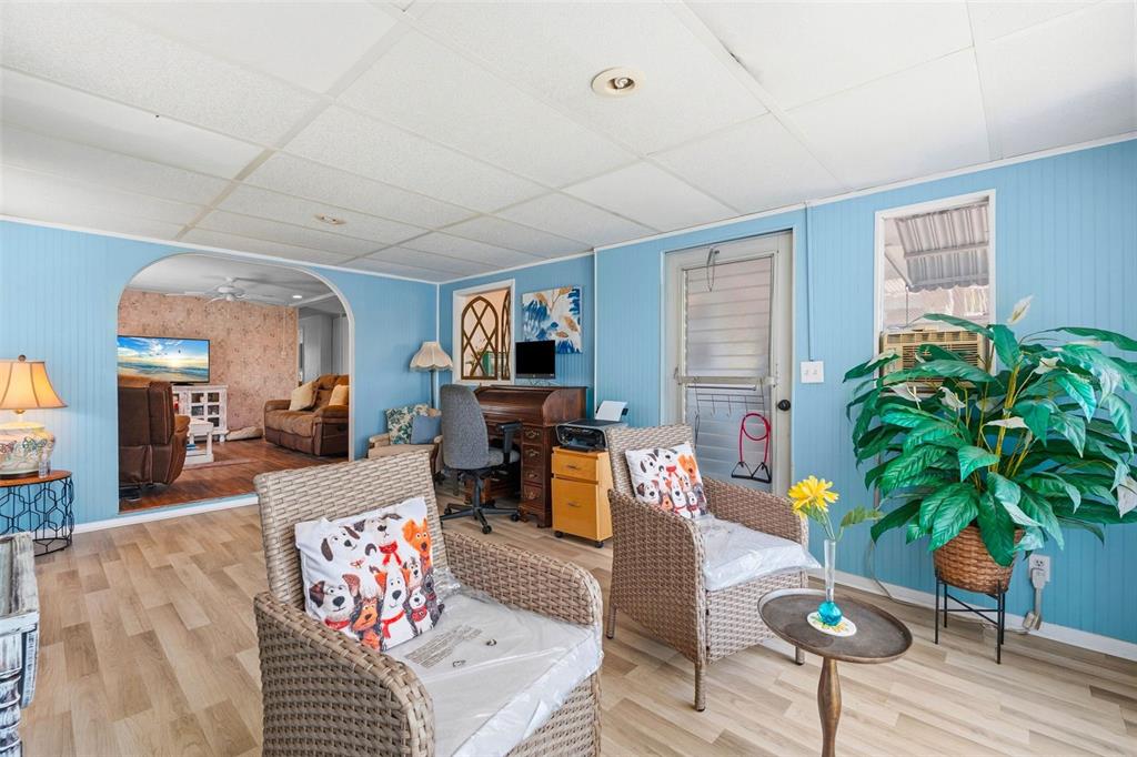 970 Jolanda Circle Venice, FL 34285 - Photo 12 of 34 a living room with furniture potted plant and a flat screen tv