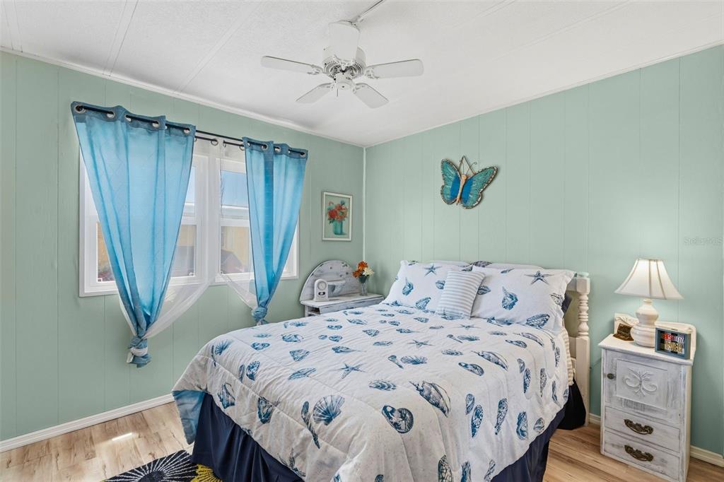 970 Jolanda Circle Venice, FL 34285 - Photo 13 of 34 a bedroom with a bed and a chandelier