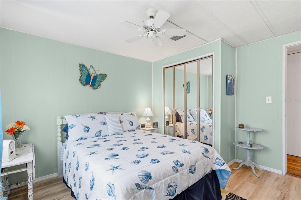 970 Jolanda Circle Venice, FL 34285 - Photo 14 of 34 a bedroom with a bed and a chandelier