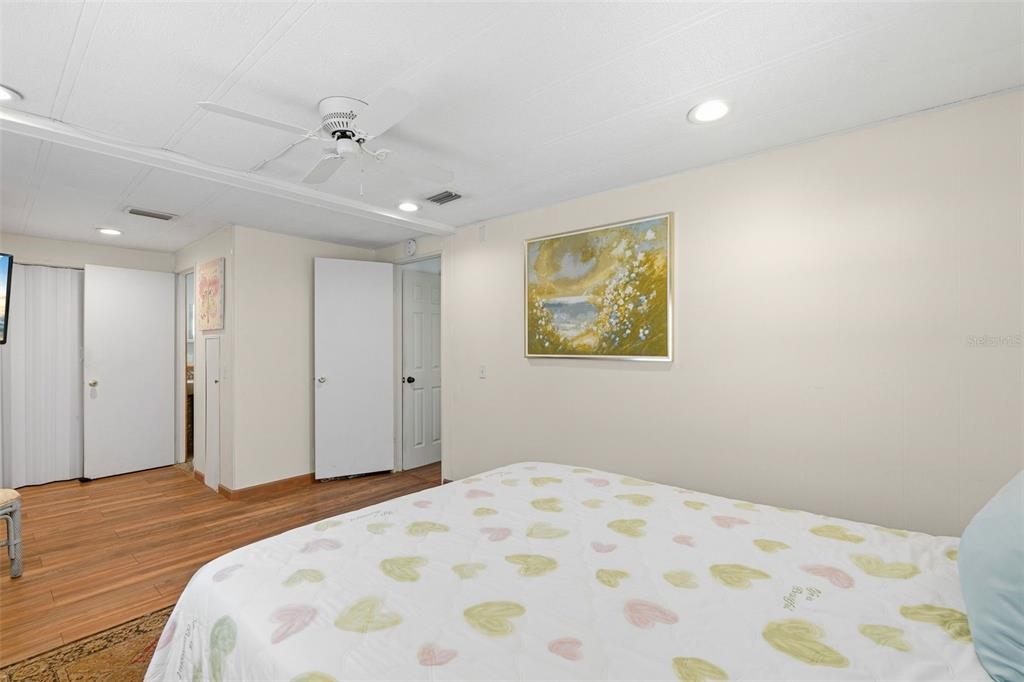 970 Jolanda Circle Venice, FL 34285 - Photo 19 of 34 a bedroom with a bed and a painting on the wall