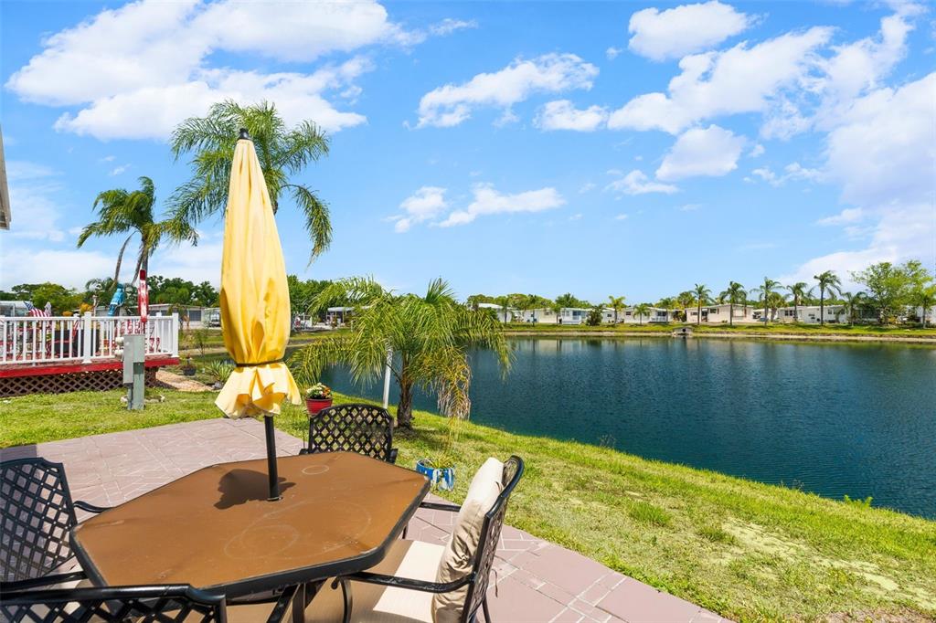 970 Jolanda Circle Venice, FL 34285 - Photo 20 of 34 a view of a lake with a table and chairs