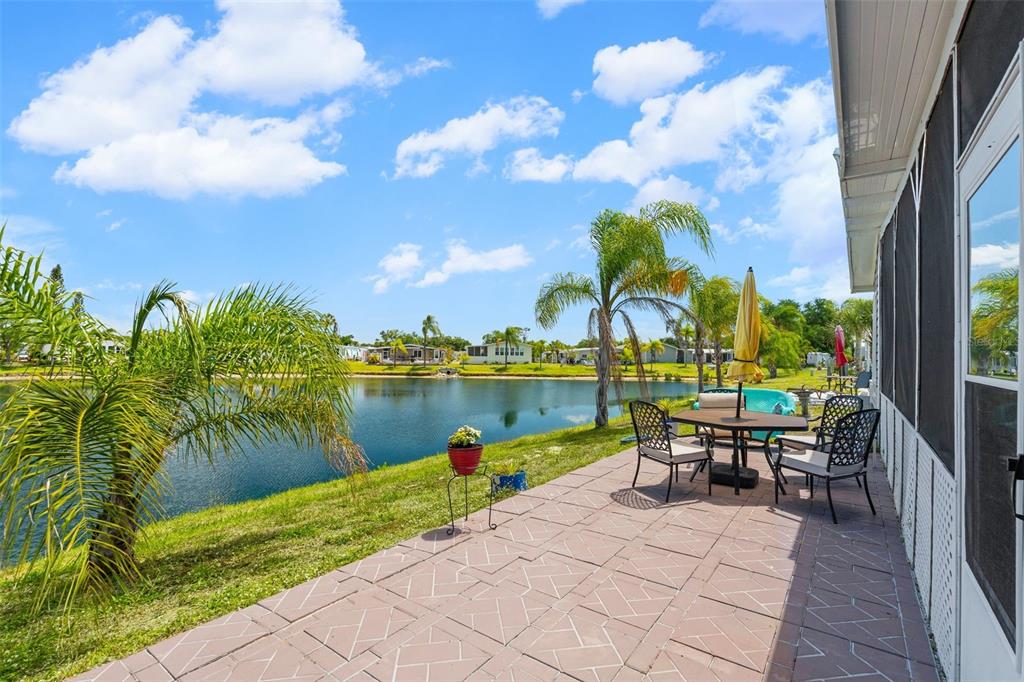 970 Jolanda Circle Venice, FL 34285 - Photo 22 of 34 a view of a lake with a table and chairs