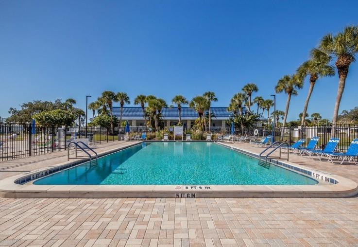 970 Jolanda Circle Venice, FL 34285 - Photo 28 of 34 a view of a swimming pool with outdoor seating and plants