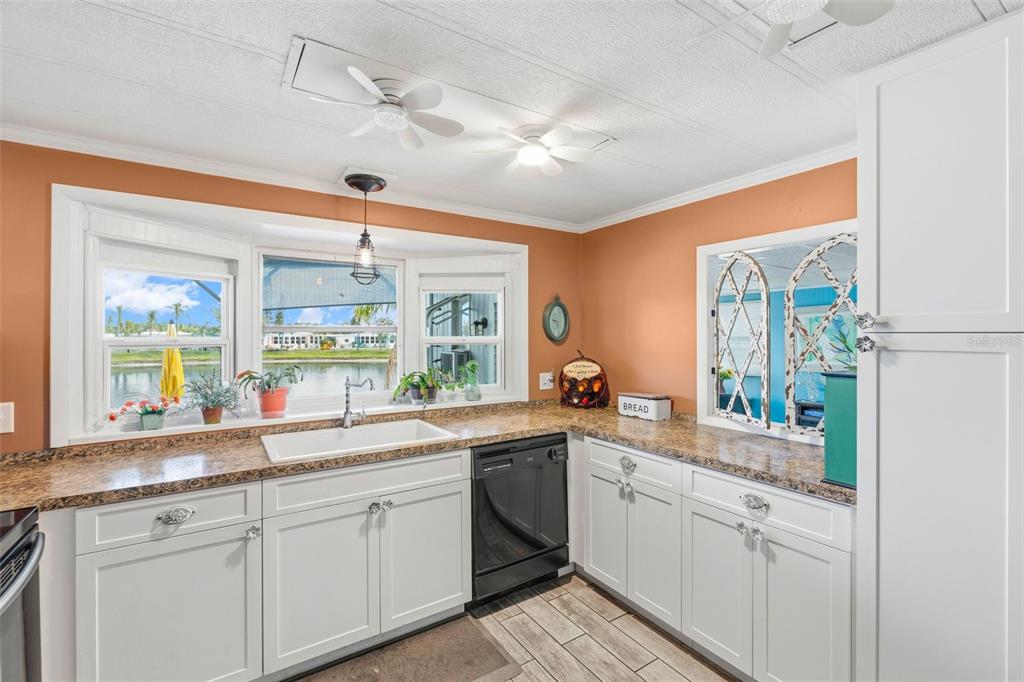 970 Jolanda Circle Venice, FL 34285 - Photo 4 of 34 a white kitchen with a sink and dish washer
