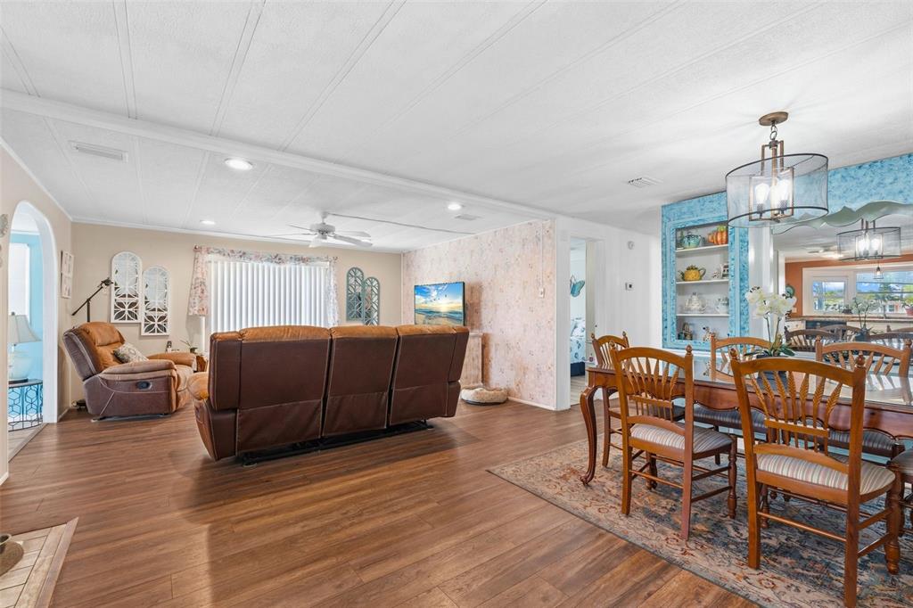 970 Jolanda Circle Venice, FL 34285 - Photo 8 of 34 a living room with furniture and a chandelier
