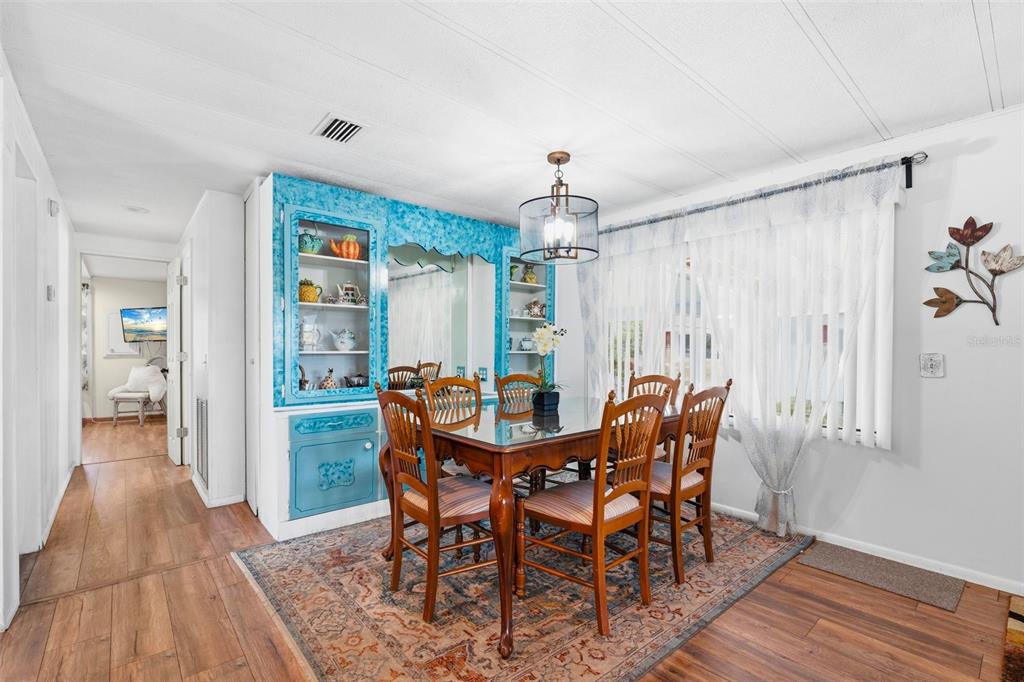 970 Jolanda Circle Venice, FL 34285 - Photo 9 of 34 a view of a dining room with furniture and wooden floor