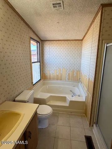 a bathroom with a bathtub and sink