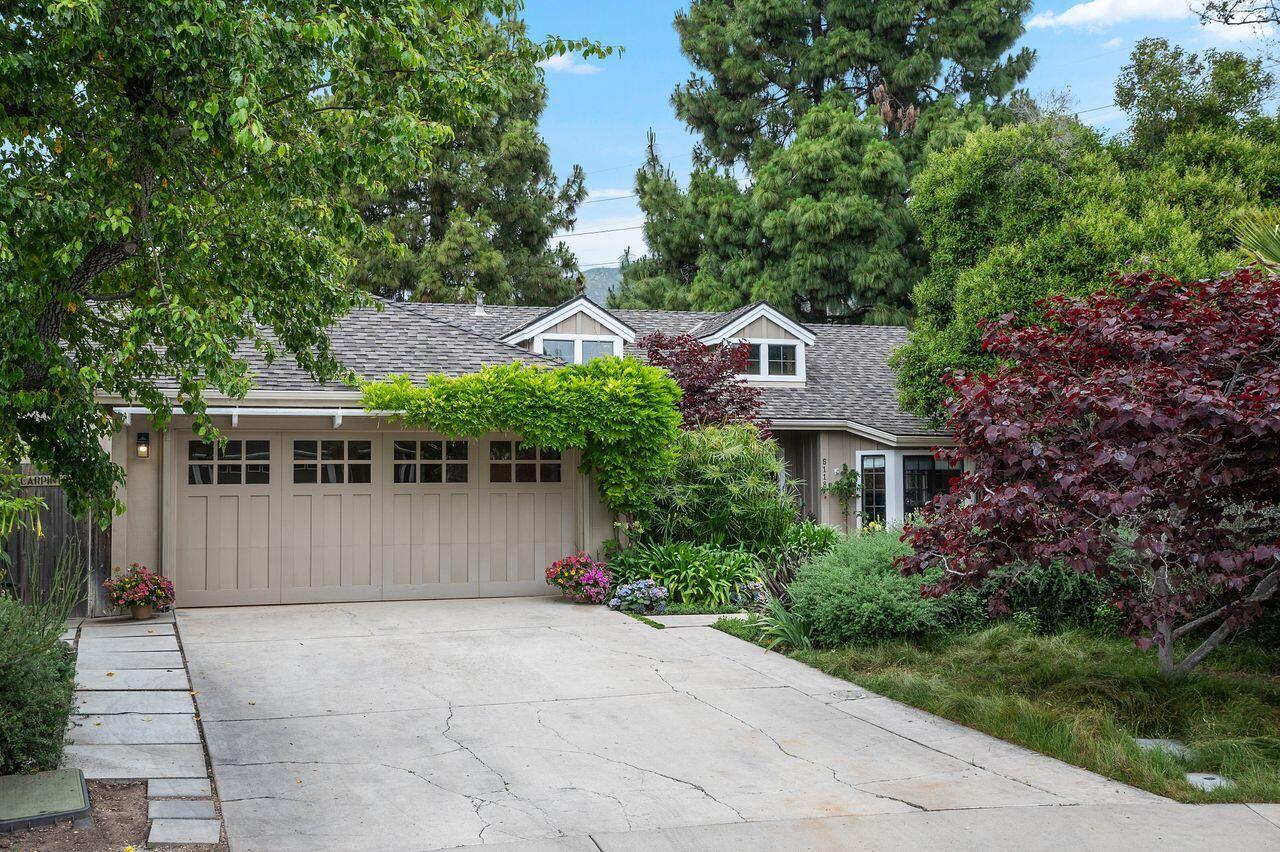 5118 Concord Place Carpinteria, CA 93013 - Photo 1 of 25 a front view of a house with a garden