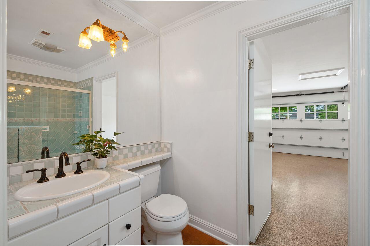 5118 Concord Place Carpinteria, CA 93013 - Photo 13 of 25 a bathroom with a sink vanity mirror and toilet