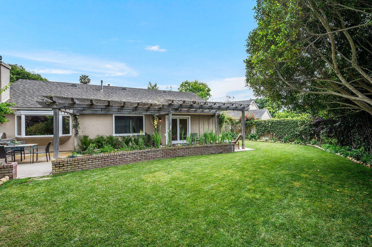 5118 Concord Place Carpinteria, CA 93013 - Photo 18 of 25 a view of a house with a yard and sitting area