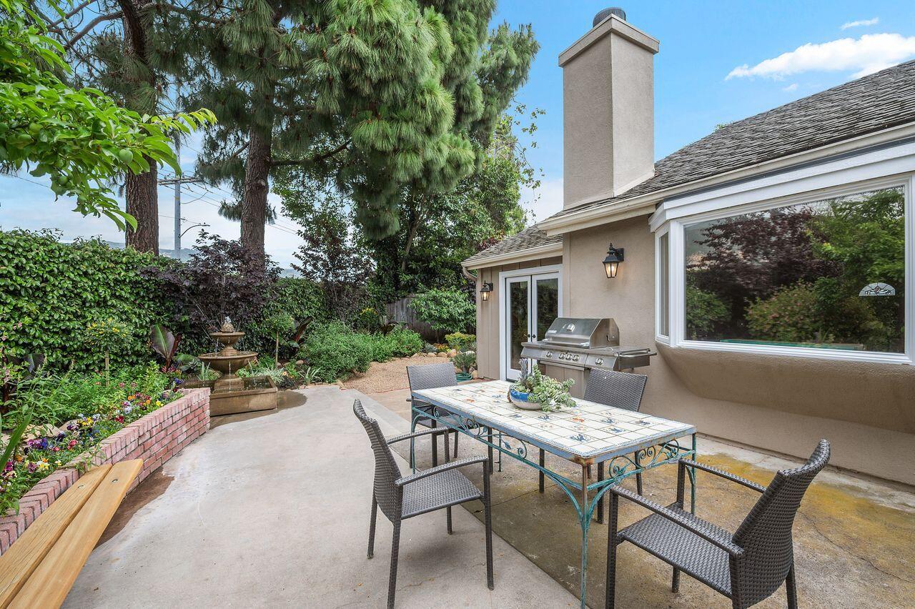 5118 Concord Place Carpinteria, CA 93013 - Photo 19 of 25 a view of a patio with table and chairs and potted plants