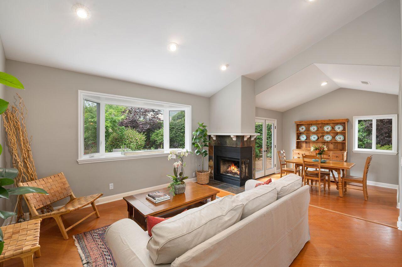 5118 Concord Place Carpinteria, CA 93013 - Photo 3 of 25 a living room with furniture a fireplace and a table