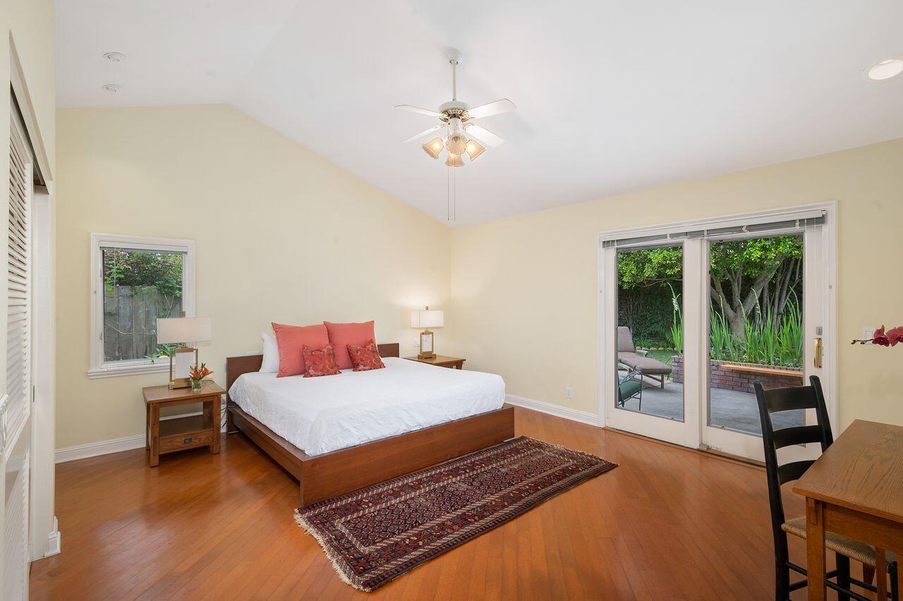 5118 Concord Place Carpinteria, CA 93013 - Photo 9 of 25 a bedroom with a bed and a table in it