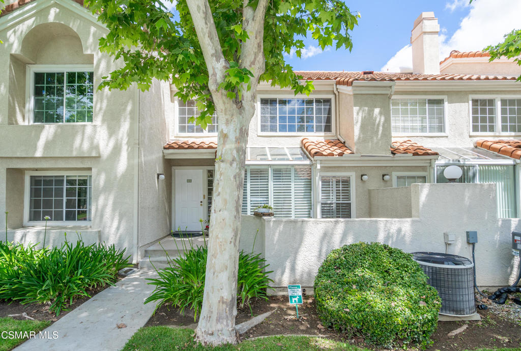 4240 Lost Hills Road, Unit 3302 Calabasas, CA 91301 - Photo 2 of 27 a front view of a house with a yard and potted plants