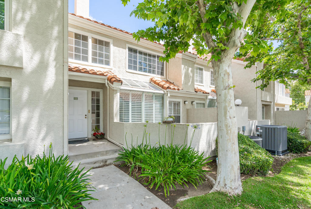 4240 Lost Hills Road, Unit 3302 Calabasas, CA 91301 - Photo 23 of 27 a front view of a house with a yard