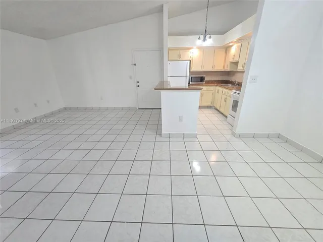 a view of a kitchen with a sink
