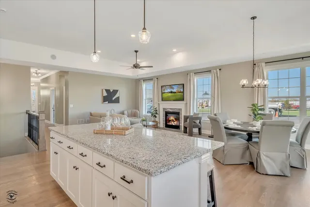 a kitchen with granite countertop living room and living room