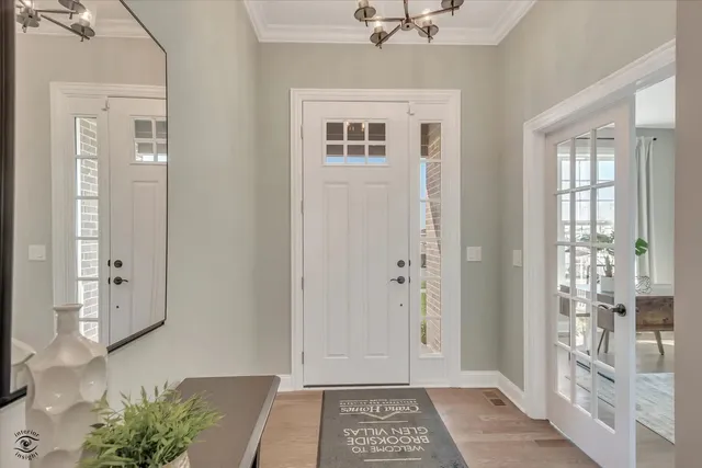 a view of an entryway with wooden floor