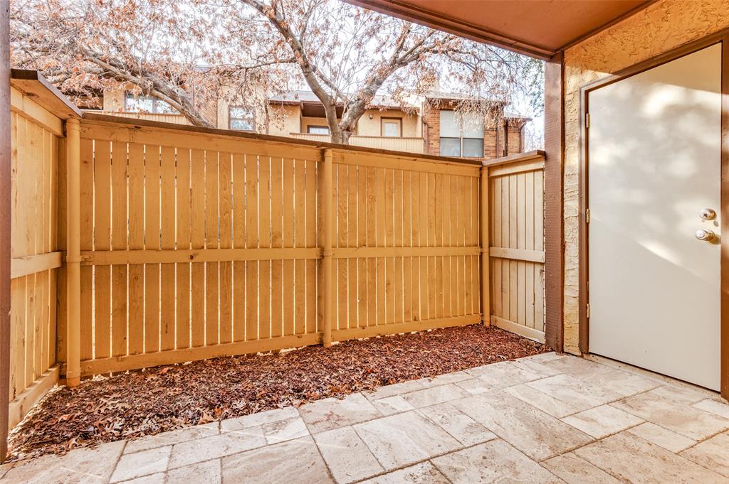 1300 Memory Lane, Unit 5214 Arlington, TX 76011 - Photo 19 of 30 Wonderful enclosed covered patio with travertine tile as well as the outdoor storage unit!