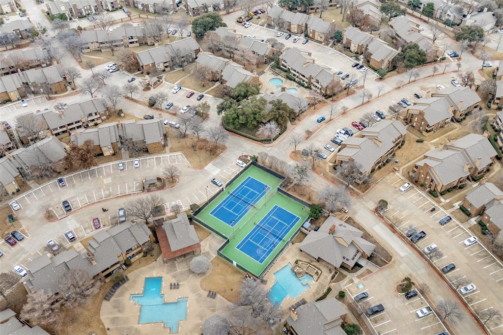 1300 Memory Lane, Unit 5214 Arlington, TX 76011 - Photo 28 of 30 Aerial view of property showing the tennis courts and surrounding area with the pools area.