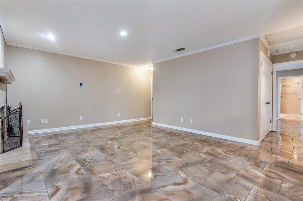 1300 Memory Lane, Unit 5214 Arlington, TX 76011 - Photo 3 of 30 View of the living room from the dining room. The washer and dryer are located down the hall behind the doors.