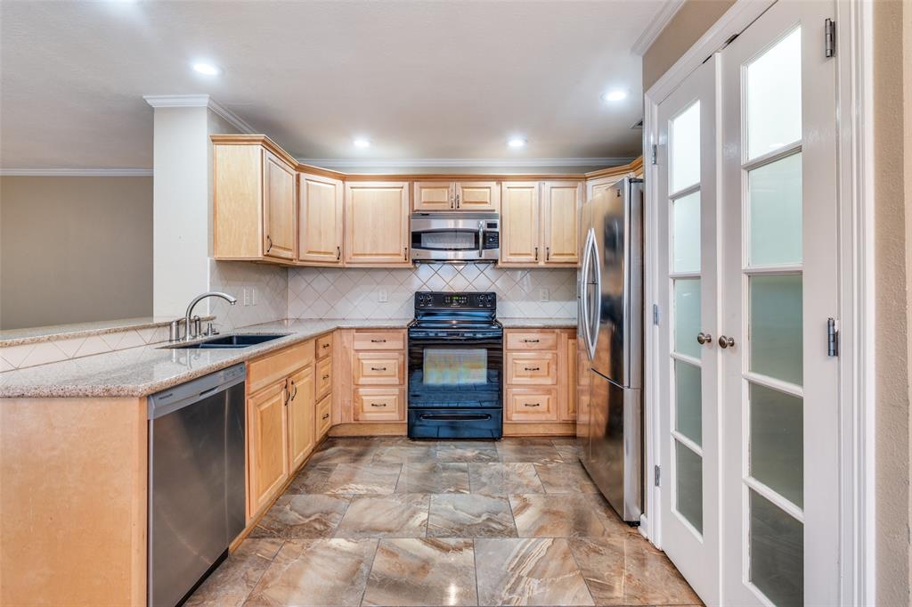 1300 Memory Lane, Unit 5214 Arlington, TX 76011 - Photo 4 of 30 Easy to entertain in this kitchen! You will always be part of the conversation and action! The pantry provides great storage!