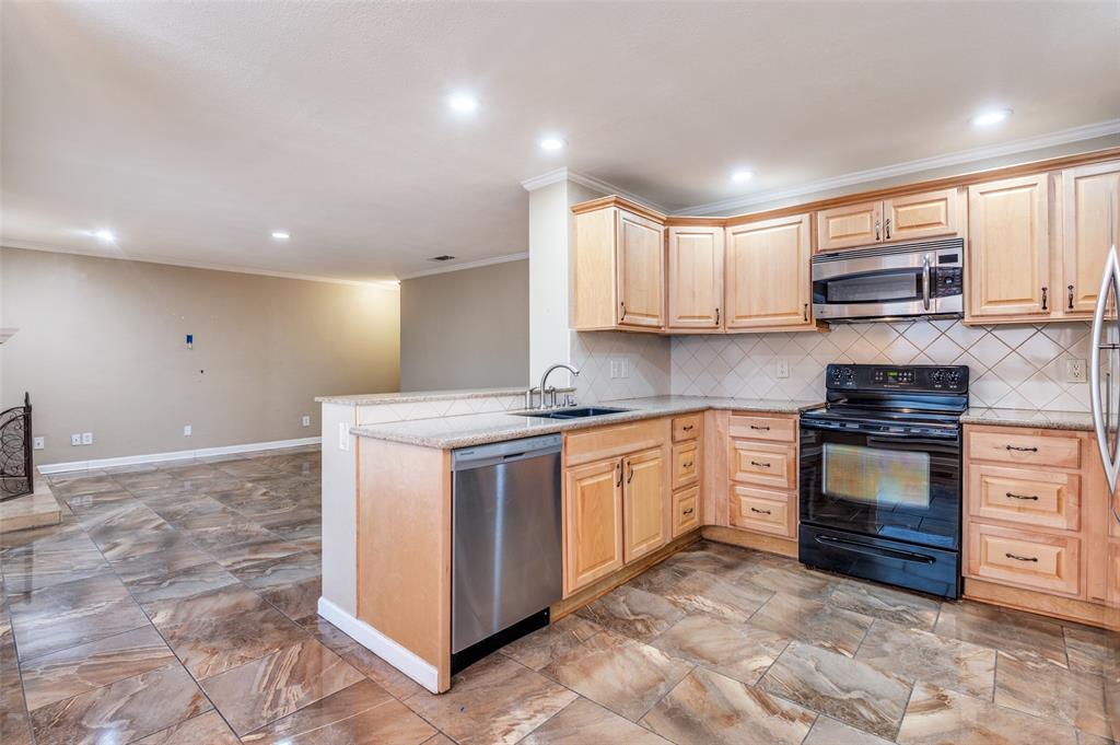 1300 Memory Lane, Unit 5214 Arlington, TX 76011 - Photo 30 of 30 Great view of the open floor plan from the kitchen to the living room.
