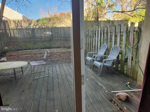 a view of a balcony with furniture
