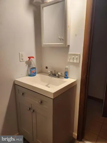 a utility room with sink dryer and washer