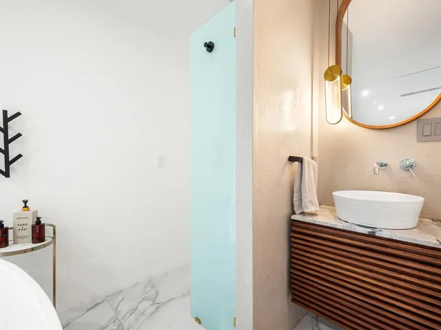 a bathroom with a sink and a mirror