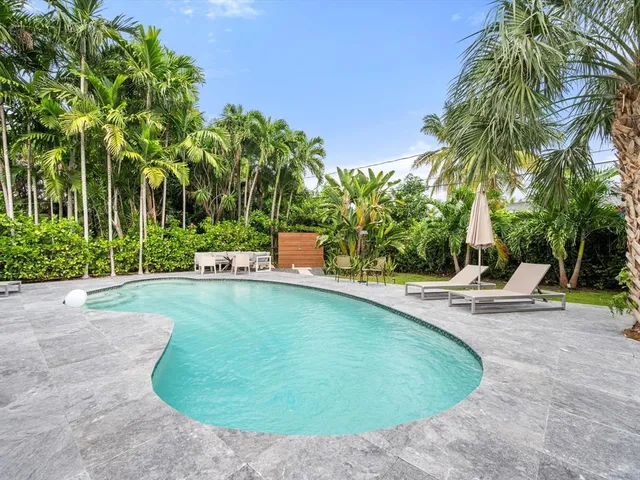 a view of a swimming pool with a patio
