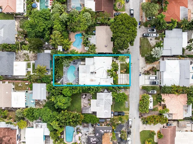 an aerial view of multiple houses with outdoor space