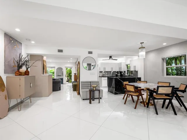 a living room with furniture and white walls