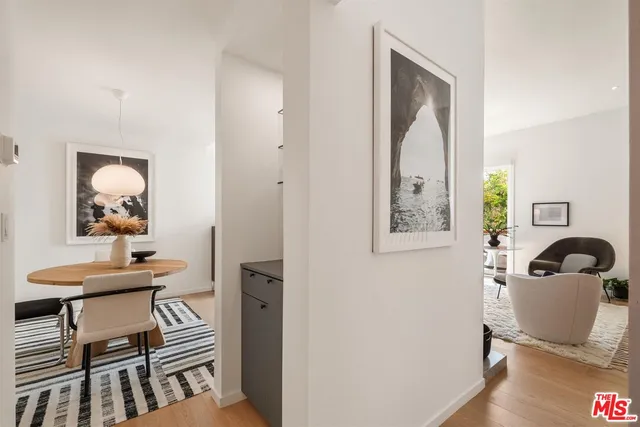 an aerial view of residential building with parking and city view