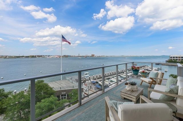 a view of a balcony with furniture