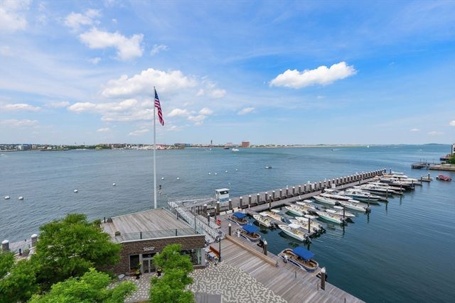 an aerial view of a house with a lake view