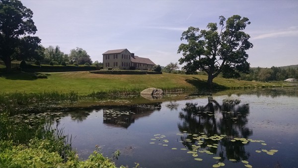 30 Mill Lane Road Brimfield, MA 01010 - Photo 11 of 12 a view of a lake with a house in the background