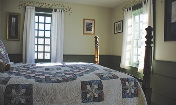 30 Mill Lane Road Brimfield, MA 01010 - Photo 9 of 12 a bedroom with a bed and a window