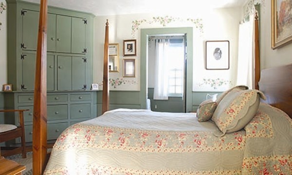 30 Mill Lane Road Brimfield, MA 01010 - Photo 10 of 12 a bedroom with a large bed and wooden floor
