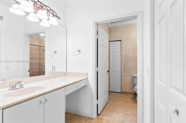 a bathroom with a sink vanity and a mirror