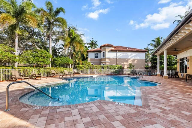 a view of a swimming pool with a patio