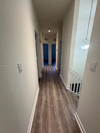 a view of entryway with wooden floor