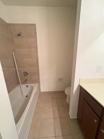a bathroom with a bathtub and a sink