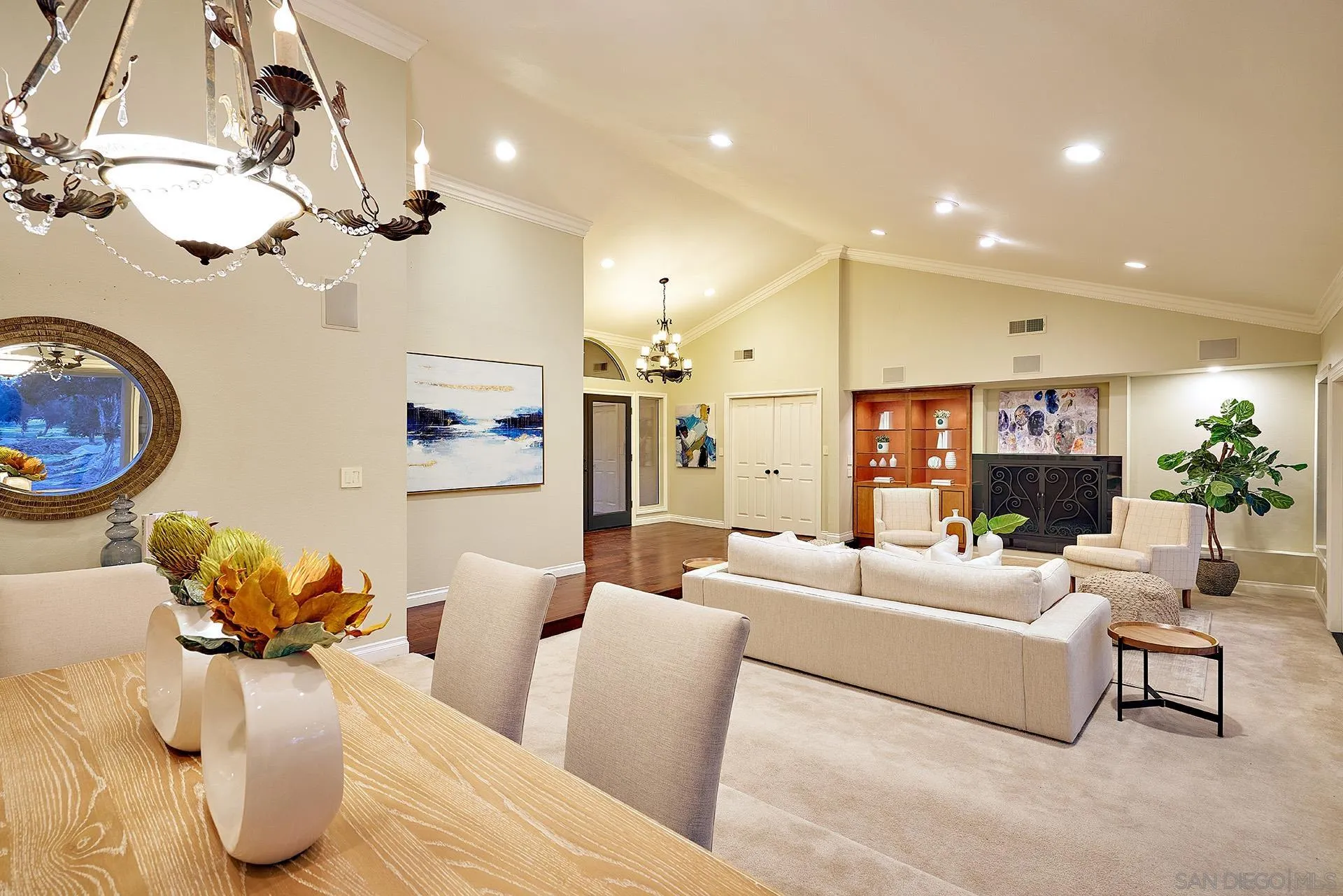 2027 Alga Road Carlsbad, CA 92009 - Photo 15 of 72 a living room with furniture kitchen view and a chandelier