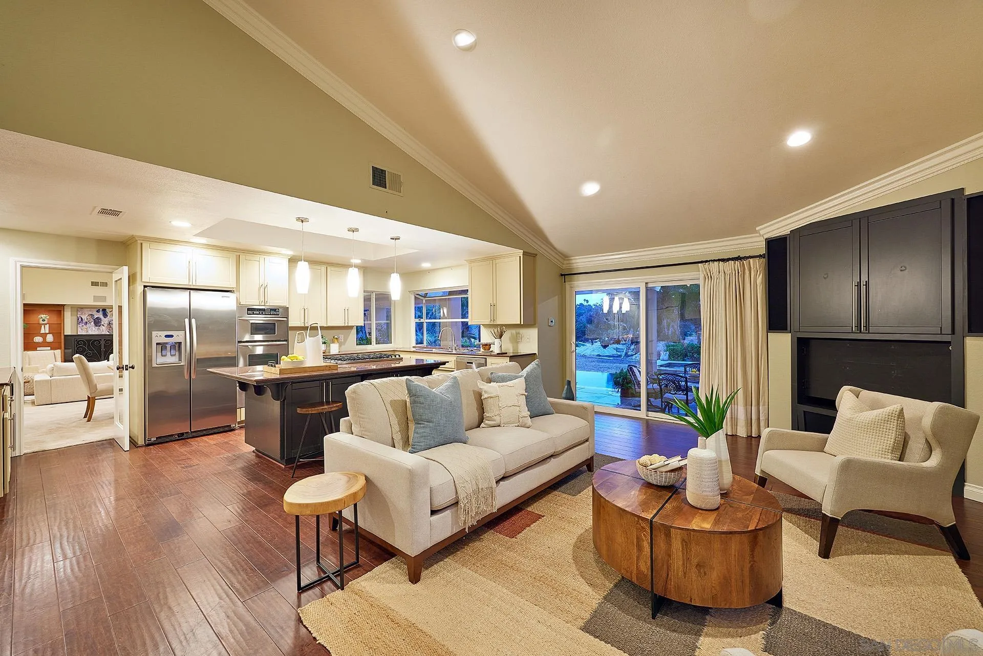 2027 Alga Road Carlsbad, CA 92009 - Photo 23 of 72 a living room with furniture kitchen view and a wooden floor